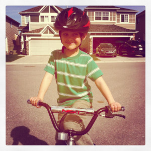 Zacharie riding a bike